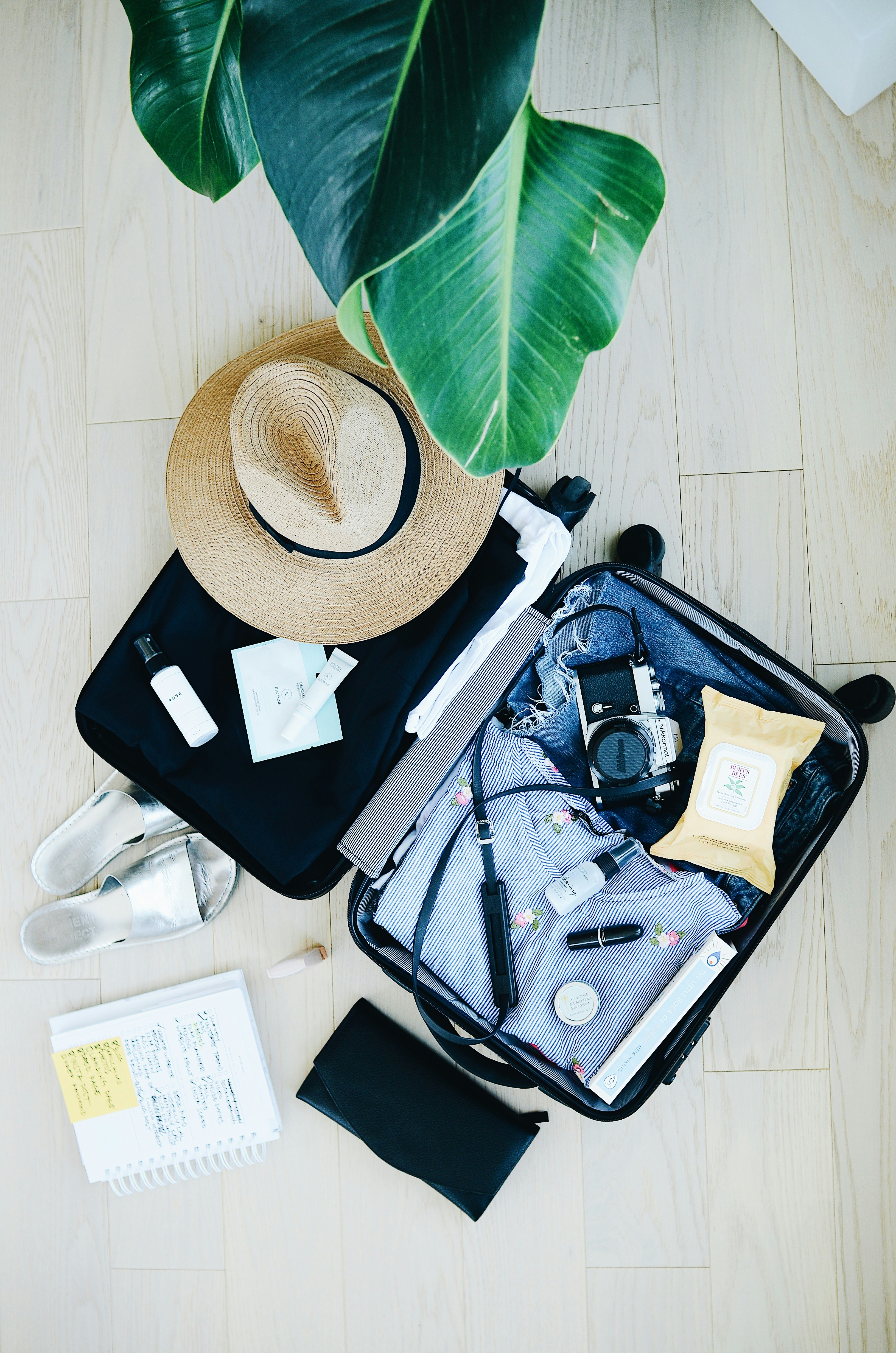 Under-seat cabin bag packed with clothes and packing cubes